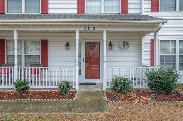 doorway to property with covered porch