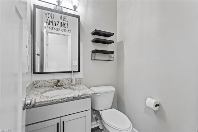 bathroom with vanity and toilet