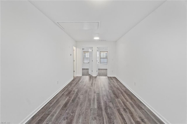 empty room with dark wood-type flooring