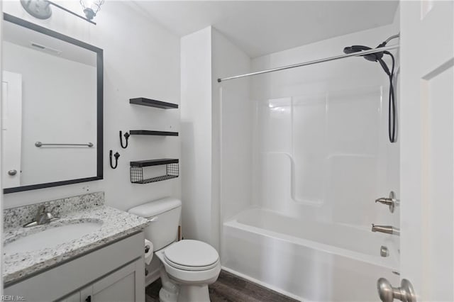 full bathroom with vanity, wood-type flooring, shower / bathtub combination, and toilet