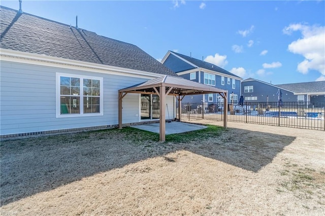 rear view of house featuring a gazebo and a patio