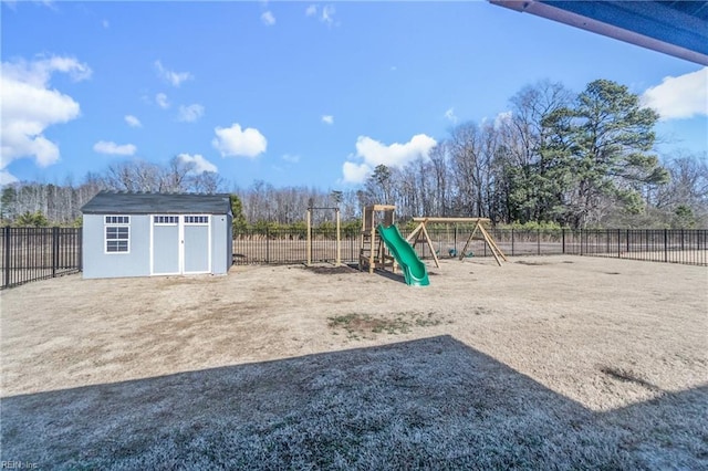 view of playground featuring a storage shed