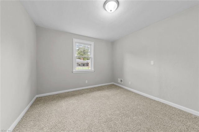 unfurnished room featuring carpet