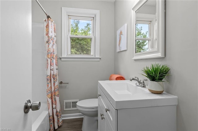 full bathroom with vanity, wood-type flooring, shower / bathtub combination with curtain, and toilet