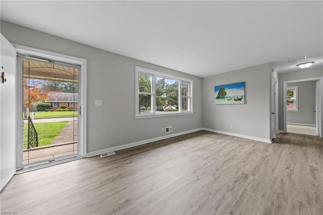 unfurnished room featuring hardwood / wood-style flooring