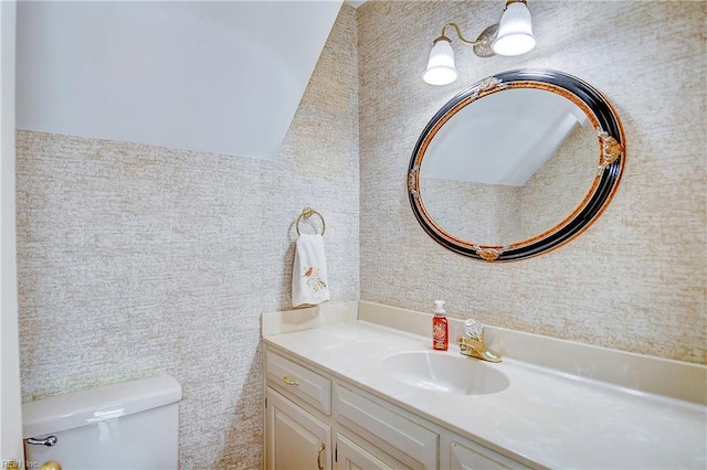 bathroom with vanity and toilet