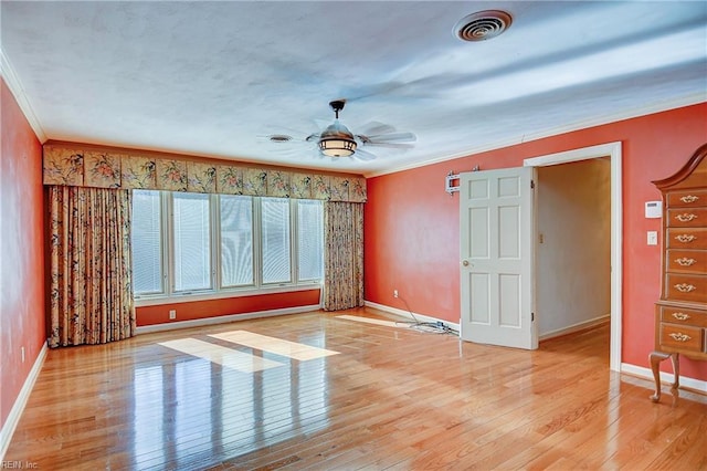 unfurnished room featuring ceiling fan, ornamental molding, and light hardwood / wood-style floors