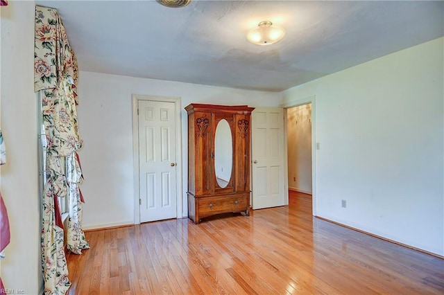 unfurnished bedroom with light hardwood / wood-style flooring