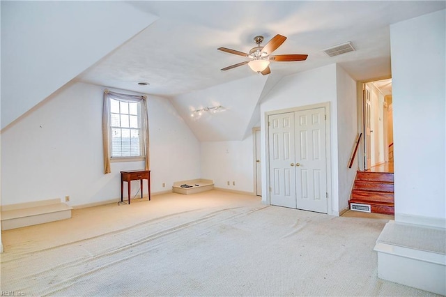 bonus room with ceiling fan, lofted ceiling, and carpet floors