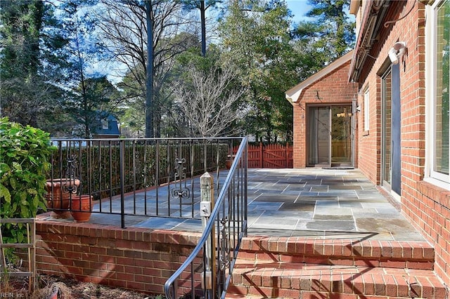 wooden deck with a patio