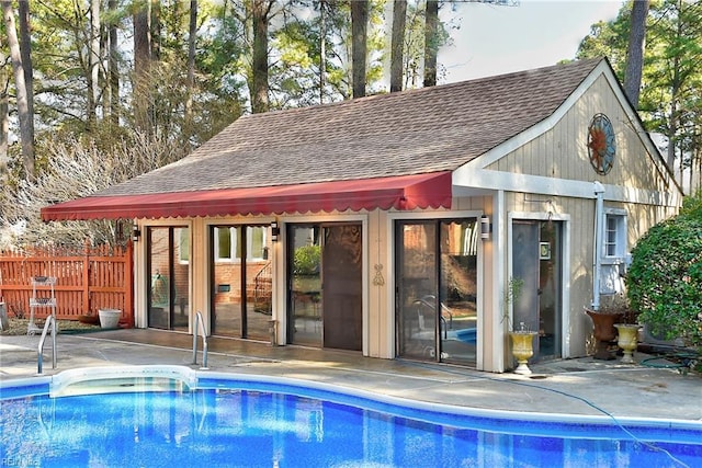 view of pool with an outdoor structure and a patio