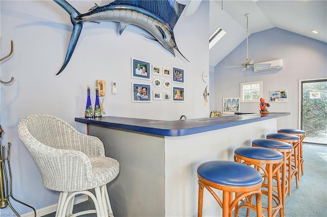 bar featuring lofted ceiling, carpet floors, a wall unit AC, and ceiling fan