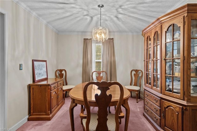 dining space with crown molding, a chandelier, and carpet flooring