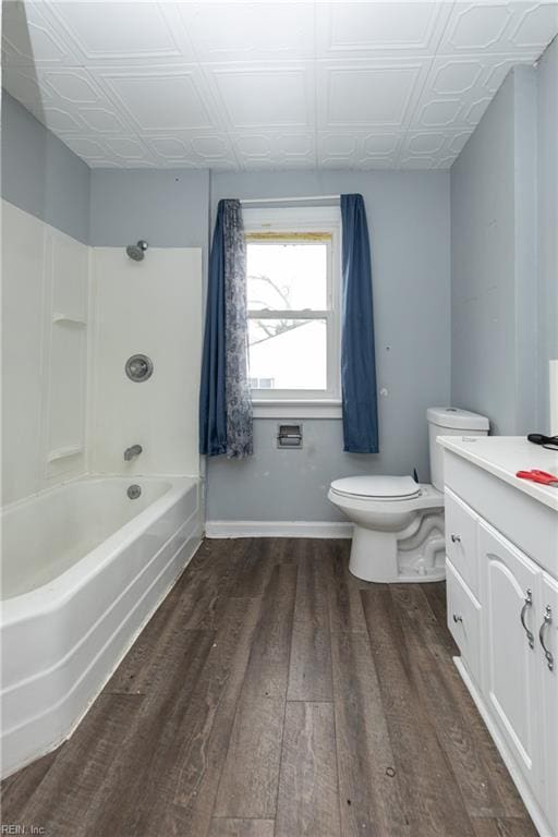 full bathroom featuring shower / tub combination, wood-type flooring, toilet, and vanity