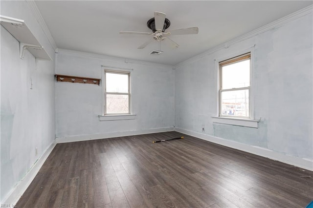 empty room with dark wood-type flooring, ornamental molding, and ceiling fan