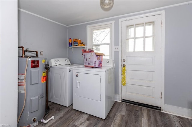 washroom featuring dark wood-type flooring, crown molding, separate washer and dryer, and electric water heater