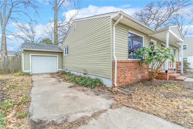 view of side of home with a garage