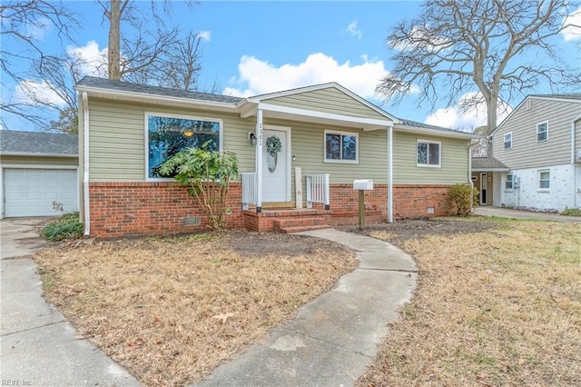 view of front of home featuring a garage and a front lawn