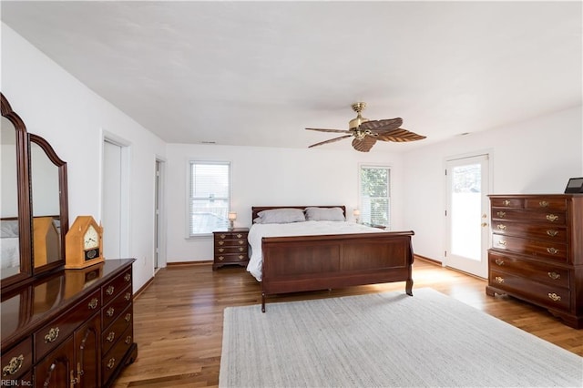 bedroom with ceiling fan and dark hardwood / wood-style flooring