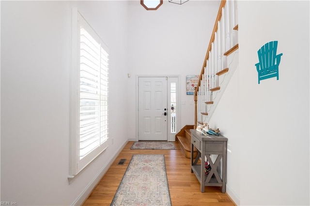 foyer entrance with light wood-type flooring