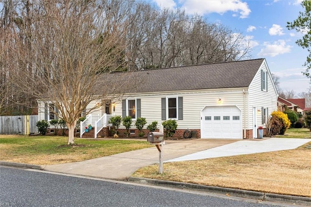 view of front of property with a garage and a front lawn