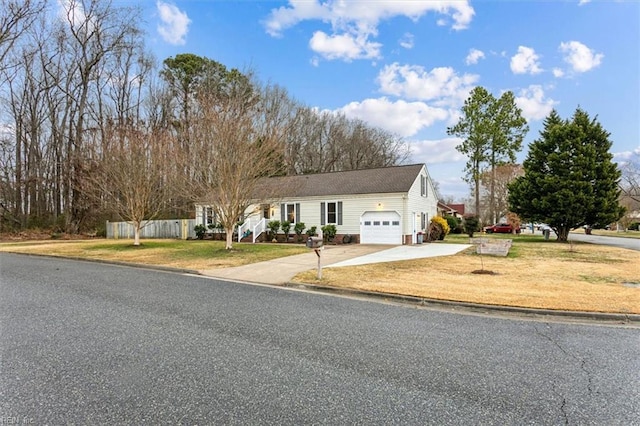 view of front facade with a garage and a front yard