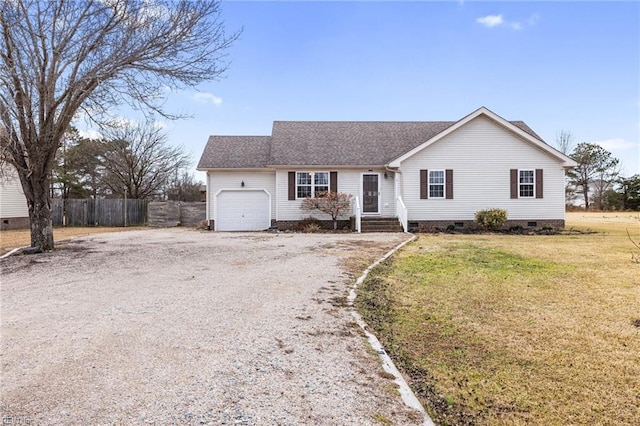 single story home with a garage and a front lawn