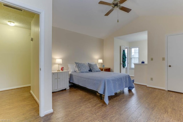 bedroom with light hardwood / wood-style flooring, ceiling fan, and vaulted ceiling