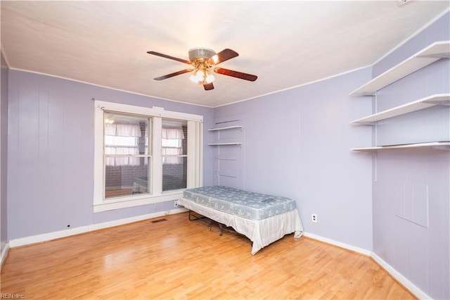 unfurnished bedroom with hardwood / wood-style floors and ceiling fan