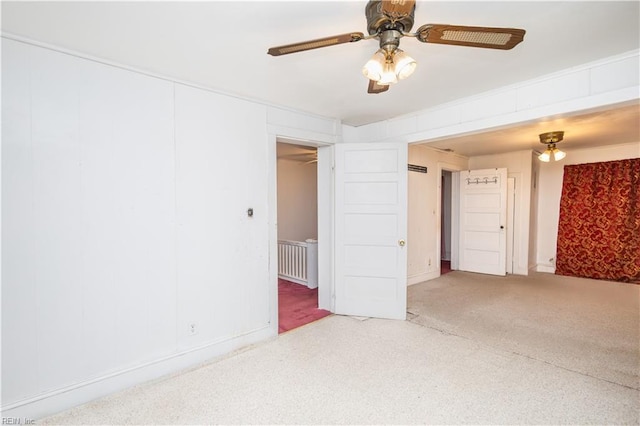 empty room with ceiling fan and carpet