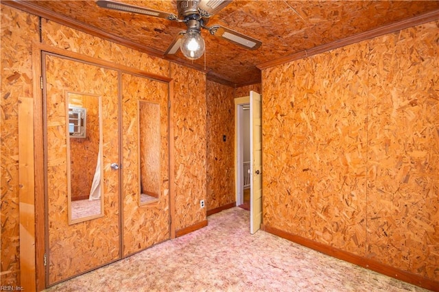 unfurnished bedroom featuring ornamental molding and carpet flooring