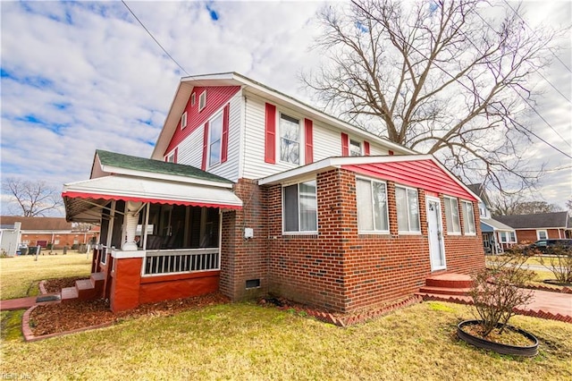 view of side of home with a yard