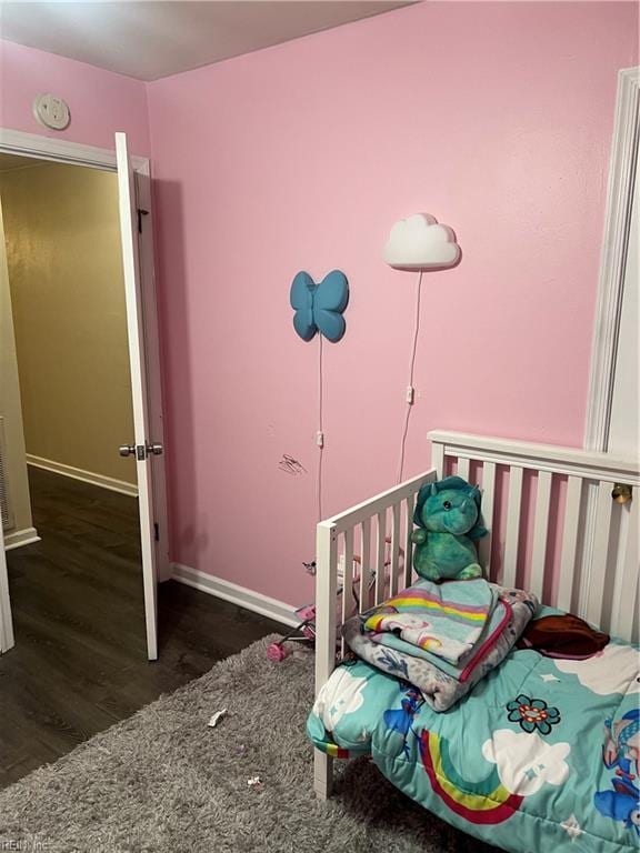 bedroom featuring dark wood-type flooring