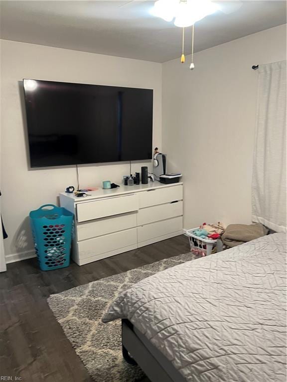 bedroom featuring dark hardwood / wood-style flooring and ceiling fan