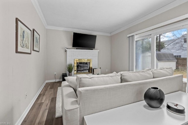 living room featuring a fireplace, ornamental molding, and dark hardwood / wood-style floors