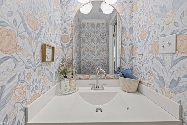 bathroom with crown molding and vanity