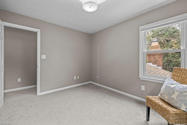 living area with light colored carpet