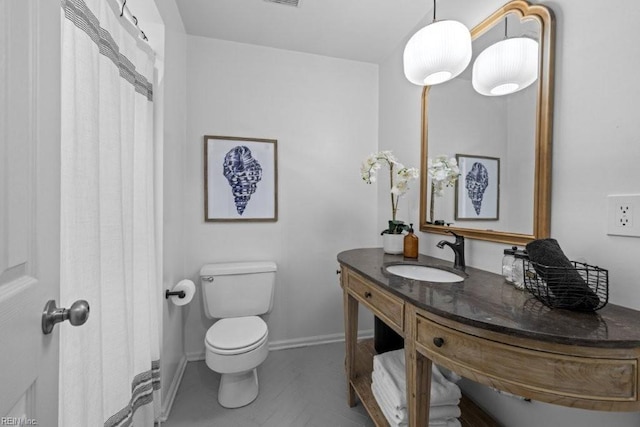 bathroom with vanity and toilet