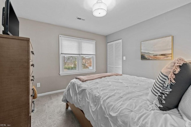 carpeted bedroom with a closet