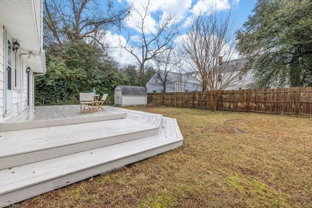 exterior space featuring a wooden deck and a storage unit