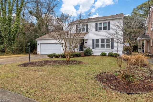 view of front of property featuring a garage and a front yard