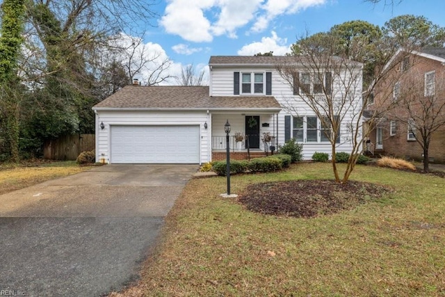 front of property with a garage and a front yard