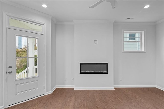 foyer entrance featuring crown molding, ceiling fan, and wood-type flooring