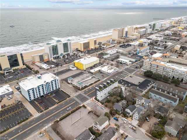 birds eye view of property featuring a water view and a view of the beach