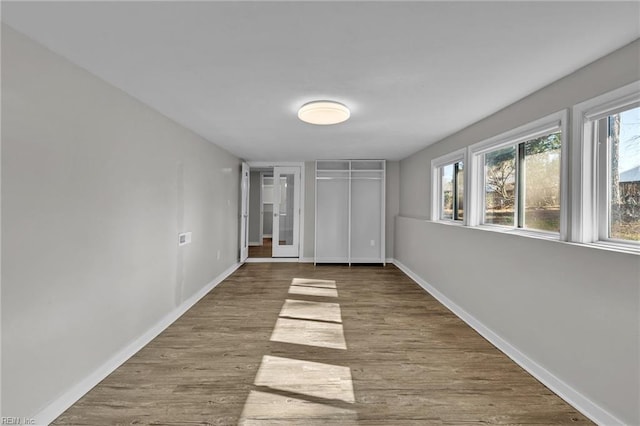 unfurnished bedroom featuring wood-type flooring