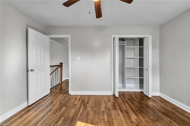 unfurnished bedroom featuring dark hardwood / wood-style flooring, a closet, and ceiling fan