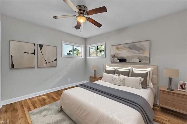 bedroom with hardwood / wood-style floors and ceiling fan