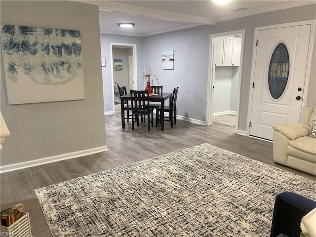 living room featuring ornamental molding and dark hardwood / wood-style flooring