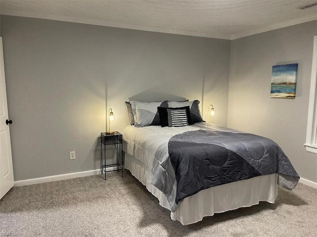 carpeted bedroom with ornamental molding