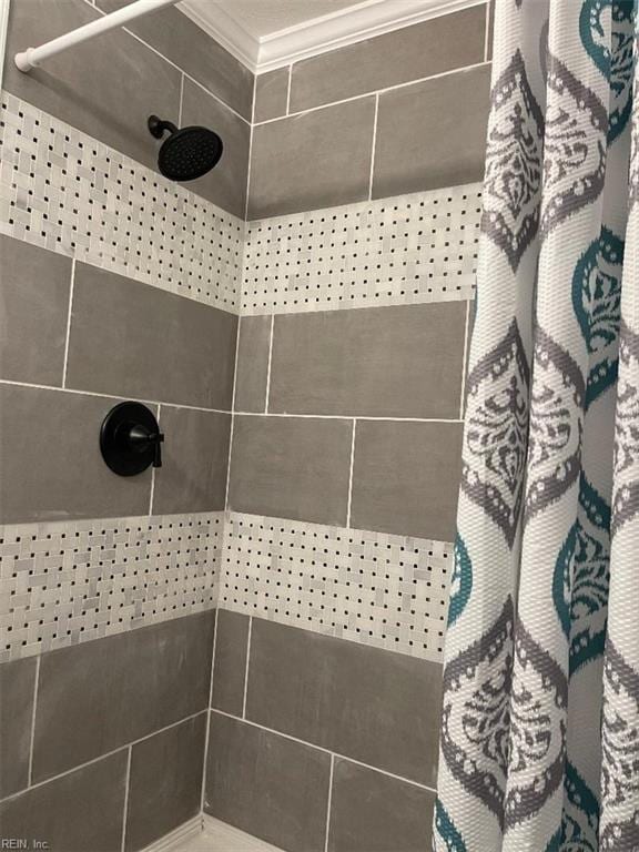 interior details featuring a shower with curtain